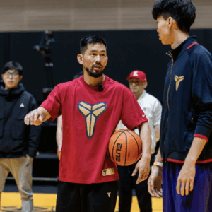 Josh Fan discussing with athlete