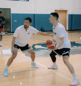 Basketball trainer demonstrating how to structure basketball training sessions with Jeremy Lin