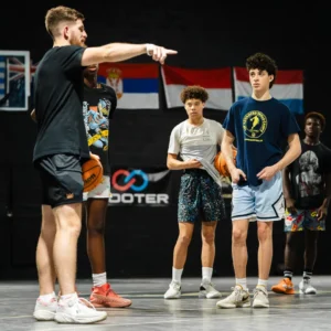 Coleman Ayers teaching basketball at By Any Means Basketball facility