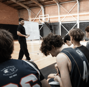 Freddy Webb teaching youth basketball players