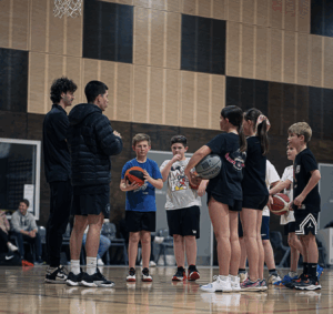 Freddy Webb teaching the youth basketball