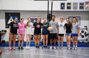 Coach Ace Carroll with youth athletes after a training session at Ace Grind Sports Performance