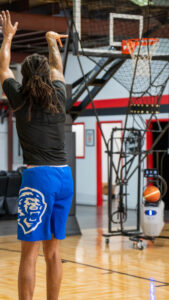 Athlete shooting on the basketball training academy court at Pro Standard